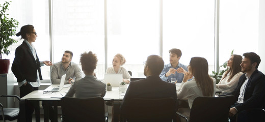 Professional business team having brainstorm meeting, panorama