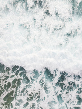 Aerial view of a man surfing at an agitated sea near Lo?inj coastline, Croatia.