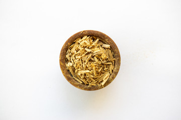 Natural aromatic incense sandalwood on a censer isolated on a white background  - obrazy, fototapety, plakaty