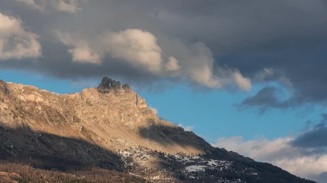 Aiguilles de Chabrieres (Chabrieres Needles) with passing clouds in winter. Afternoon to sunset Time-lapse. Ecrins national Park, Hautes-Alpes, European Alps, France