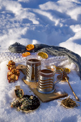 New Year or Christmas flat lay top view with Hot  tea, dry orange, apple, Herb,  black chokeberry, Rhododendron adamsii, flower of apple, spoon with honey
