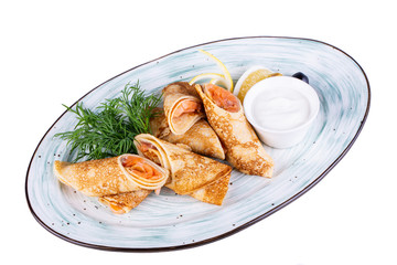 Pancakes with red fish, served with sour cream