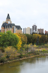 Fototapeta na wymiar Vertical of Saskatoon, Canada skyline over river