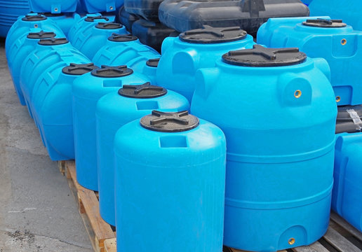 Blue plastic water and liquids barrel storage containers