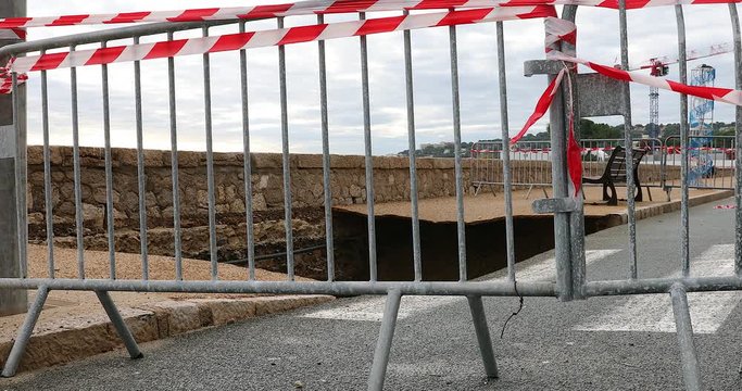 Large Hole In The Collapsed Sidewalk Behind Security Barriers In Menton On The French Riviera, Sea Front Is Closed Due To Heavy Flooding Caused By Big Waves, France, Europe - DCi 4K Resolution