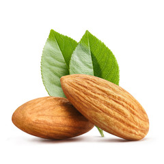Close-up of two ripe almonds with green leaves, isolated on white background