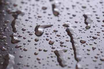 frozen water droplets on a metal surface