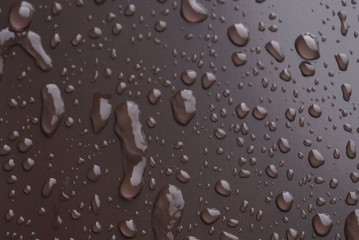frozen water droplets on a metal surface