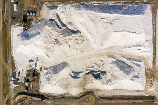 Aerial view of machines working at salt production facility, Australia.