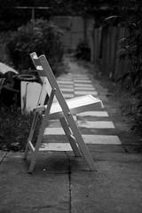 Chair as a symbol of loneliness, black and white photo
