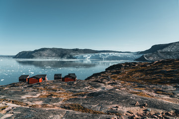 Panoramic image of Camp Eqi at Eqip Sermia Glacier in Greenland. nature landscape with lodge...