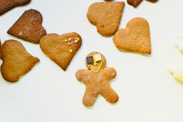 Homemade gingerbread cookies with colorful decorations and chocolates.