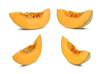 Four delicious cantaloupe melon slices in a cross-section, isolated on white background with copy space for text or images. Side view. Close-up shot.