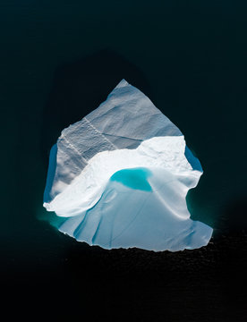 Icebergs drone aerial image top view - Climate Change and Global Warming. Icebergs from melting glacier in icefjord in Ilulissat, Greenland. Arctic North Pole nature ice landscape in Unesco World