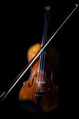 Fototapeta premium Instrument Violin on black background