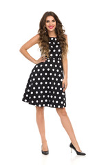Beautiful Fashion Model In Black Cocktail Dress In Polka Dots And High Heels.