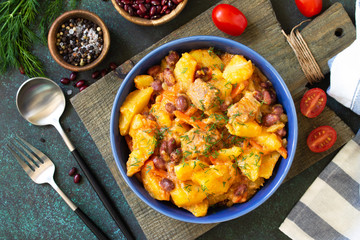 Thanksgiving Autumn Menu. Stew with beans and vegetables in a bowl on a rustic table. Top view of a flat lay with copy space.
