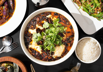 Spicy Sichuan fish soup made with cod, cilantro, and chilis. Authentic Chinese food. 