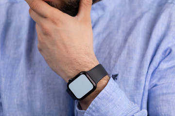 Close up of Businessman's hand looking at hand watch