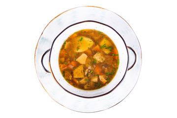 Meat soup with vegetables, served in a deep plate