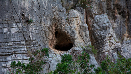 cave in the vertical wall
