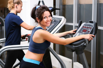 Fototapeta premium Woman posing training on exercise bike