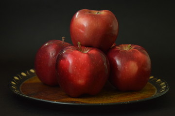 Red Apples On Wooden Plate Black Background
