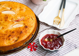 Homemade apple pie with jam and plate.