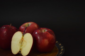 Red Apples Whole And Cut On Wooden Plate