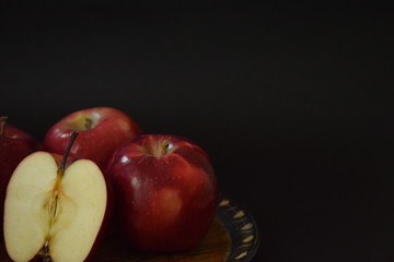 Red Apples Whole And Cut On Wooden Plate