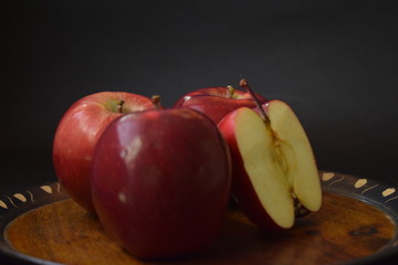 Red Apples Whole And Cut On Wooden Plate