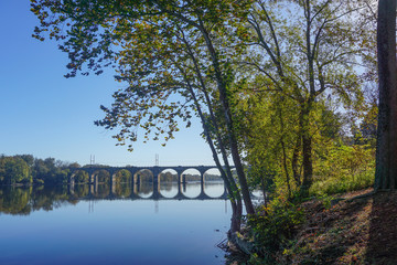 Yardley, PA: A stone bridge spans the Delaware River near Yardley, Pennsylvania.