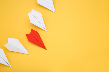 Paper plane leader on yellow background