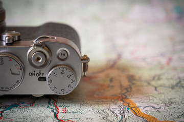 Vintage camera on a map.