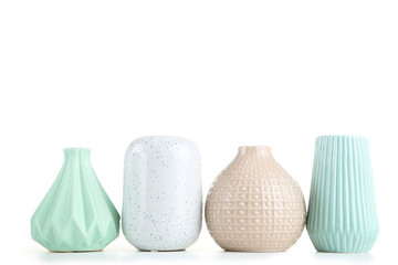 Different ceramic vases isolated on white background