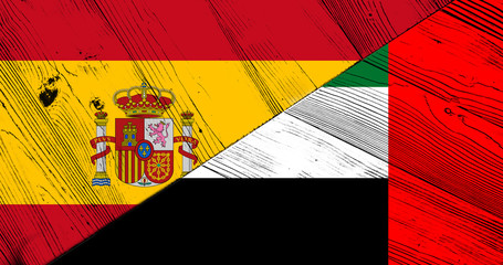 Flag of the United Arab Emirates and Spain on wooden planks
