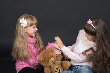 The child's hands are decorated with special colored paints for the skin. Shooting in the Studio