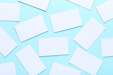 Blank business cards on blue background