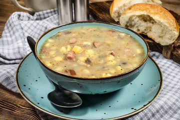 Traditional polish soup Zurek in ceramic bowl.