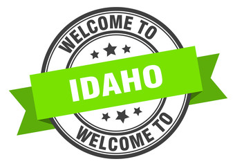 Idaho stamp. welcome to Idaho green sign