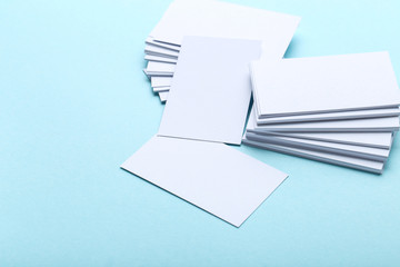 Blank business cards on blue background