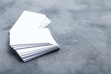 Blank business cards on grey background
