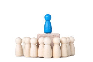 Leader concept. Wooden figures on white background