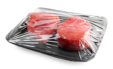 Fresh raw beef cut in plastic container isolated on white