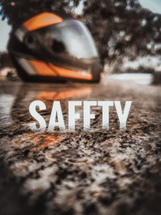 Helmet in background and Text Safety