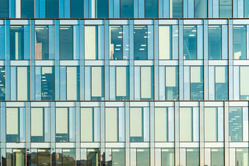 Glass facade texture of a modern office building. High tech architecture. Elements of urban design....