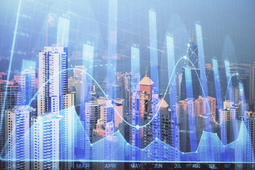 Forex graph on city view with skyscrapers background multi exposure. Financial analysis concept.