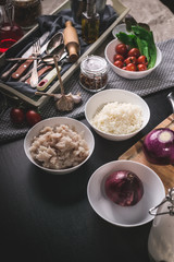 Vertical shot ingredients for homemade fish pie. Kitchen still life. Homemade baking