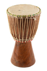 Ethnic musical instrument. African drum made of mahogany wood and goat leather isolated on white...