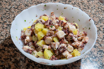dish with octopus and potato salad. Mediterranean food